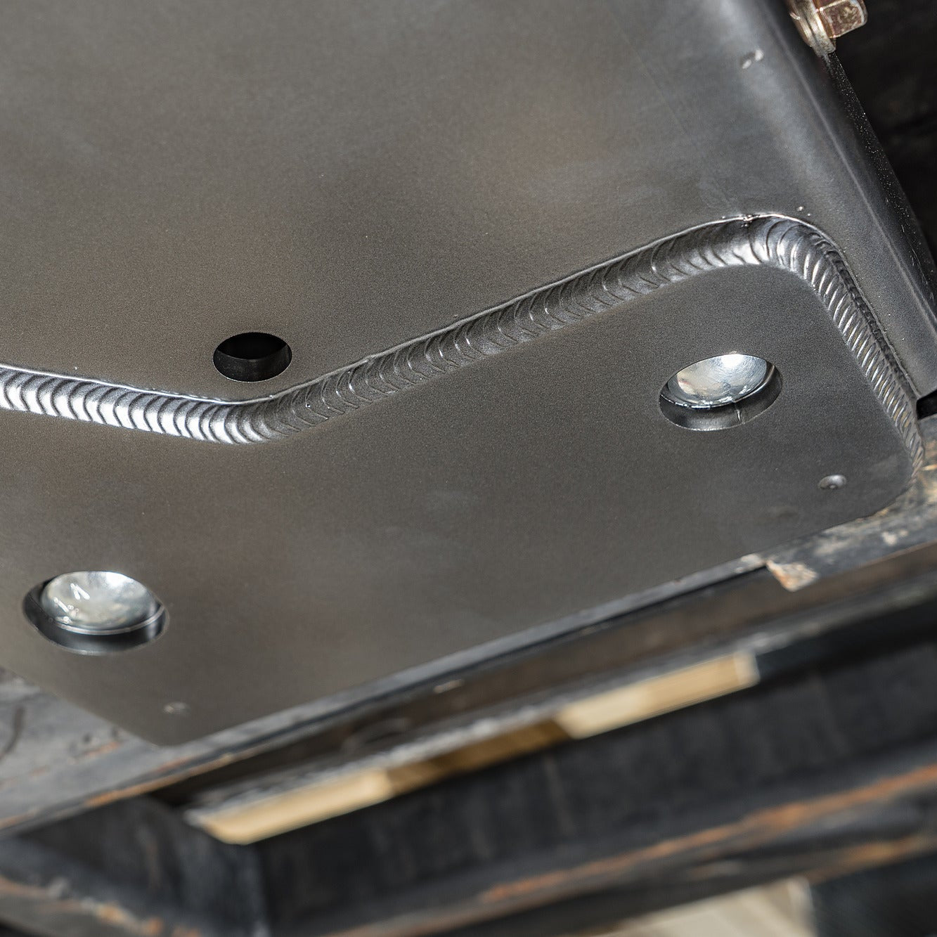 Product photo of the DRT flat belly skid plate kit components laid out before install