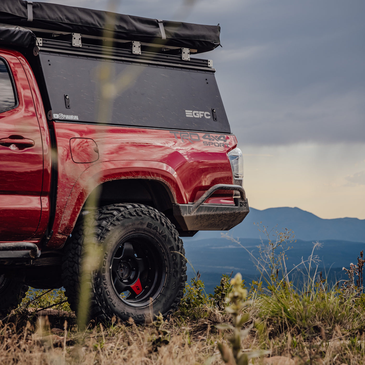DRT Labor Day Sale, red 3rd Gen Tacoma with High Clearance Rear Bumper in the mountains