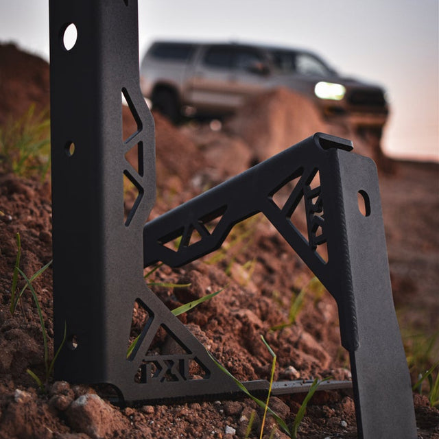 Close-up of the DRT bed stiffener showing the additional tie-down points and textured black powder coat