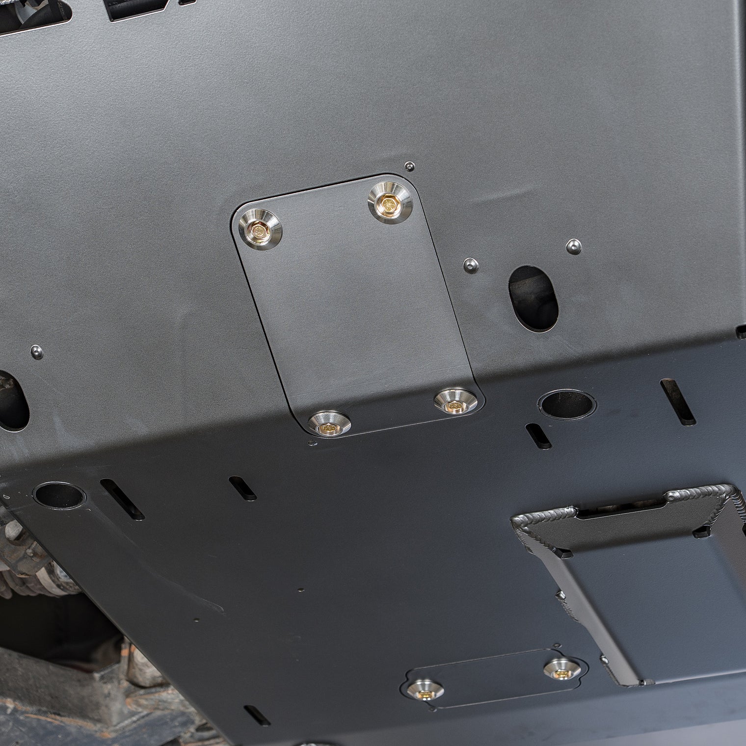 Detail of the heavy-duty bolt-in crossmember between the Tacoma frame rails