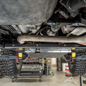 Bottom view showing the flat belly skid plate fully installed on a 2005-2023 Toyota Tacoma