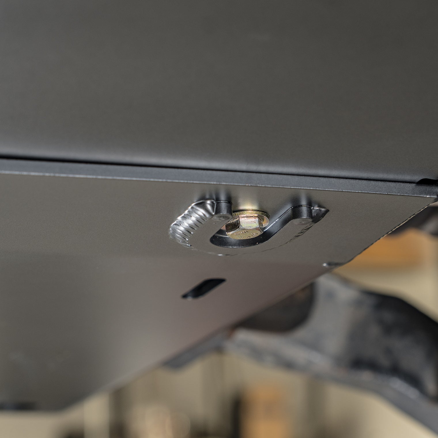 Stainless CNC-machined hardware on the DRT CMD skid plate panel access points