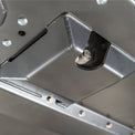 DRT flat belly skid plate kit ground clearance demonstrated next to OEM crossmember for comparison