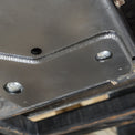 Product photo of the DRT flat belly skid plate kit components laid out before install