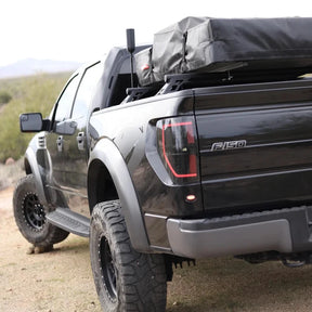 DRT Lo-Pro bed bars installed in a Ford F-150 Raptor bed with a roof top tent mounted