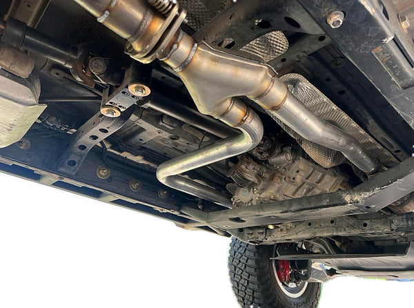 Rerouted exhaust on a 2005-2023 Toyota Tacoma clearing the DRT flat belly transfer case skid crossmember